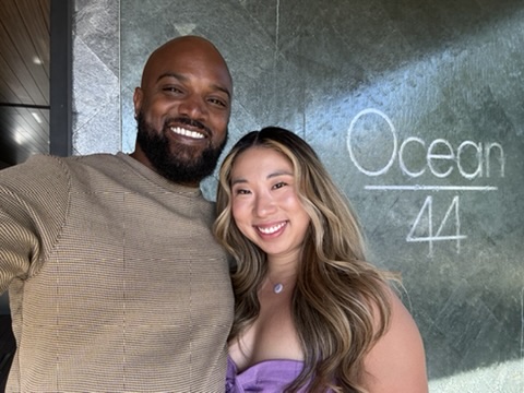 Elissa and Wiley smiling together on a night out at Ocean 44